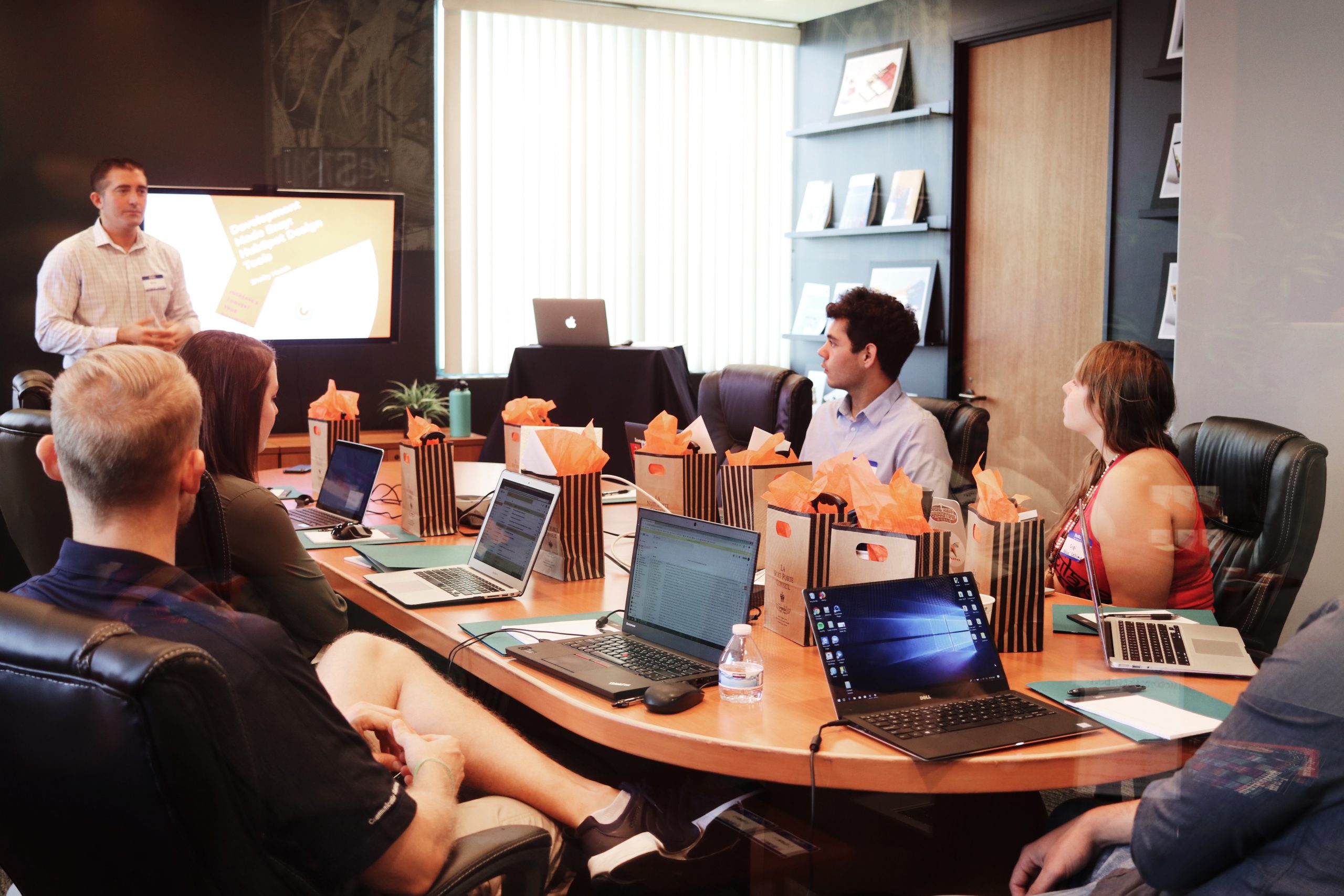 Marketing team sitting at a conference table.